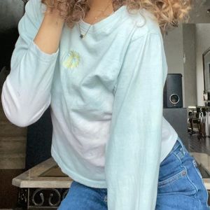 Pink and blue long sleeve shirt with moon and sun logo